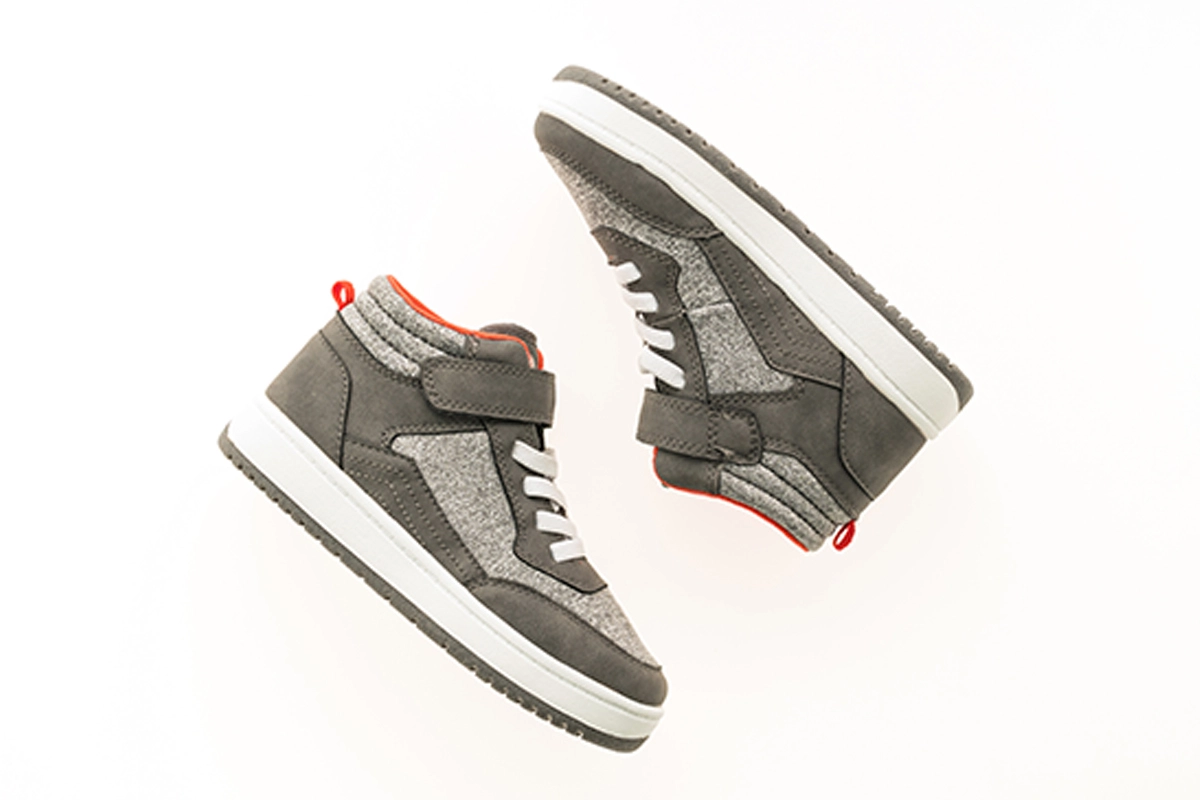 Footwear Photo Editing Service, Retouching and Enhancement A side-by-side comparison of two shoe photos: Left: A worn-out shoe with visible scratches, scuffs, and dust marks. Right: The same shoe after expert retouching, showcasing a flawless and restored look with enhanced colors and detailing.