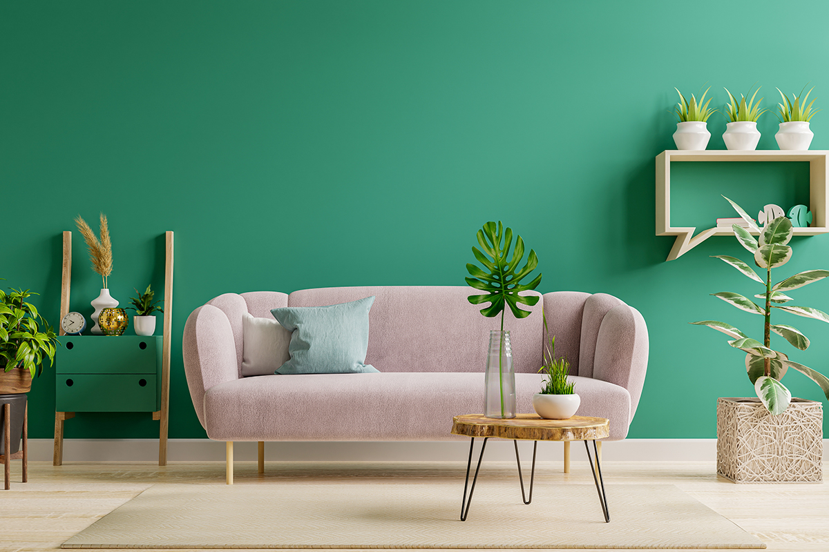 Furniture Image Editing Service, A captivating image showcasing a pink sofa situated in a vibrant green-walled room, highlighting the bold color contrast and enhanced furniture details through expert photo editing.